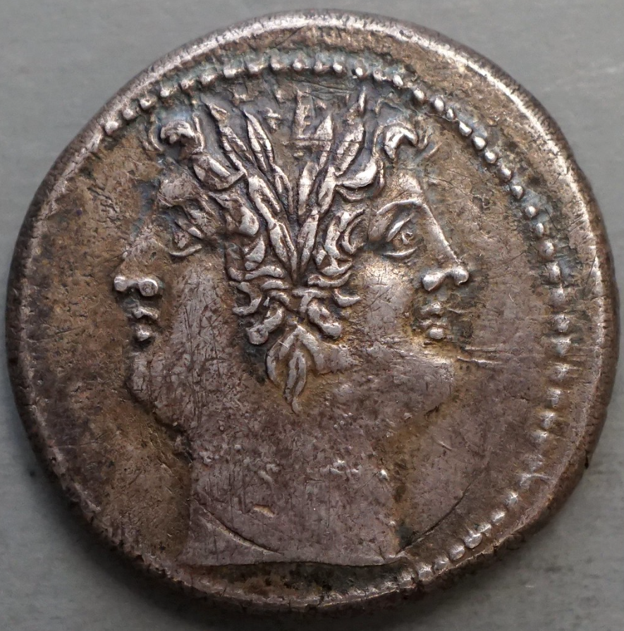 janus, a two-faced deity, depicted on a roman coin